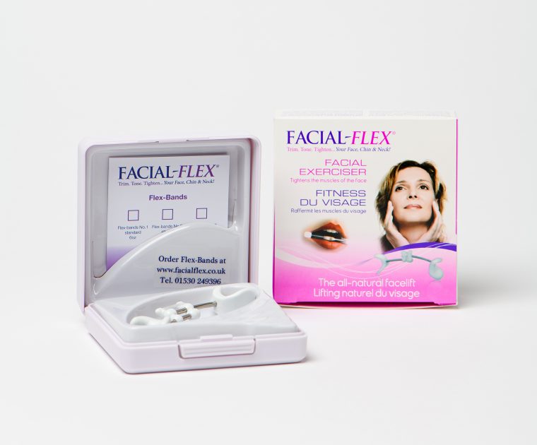 Open box containing Facial Flex device with outer packaging