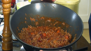 Chilli con carne cooking in an electric wok