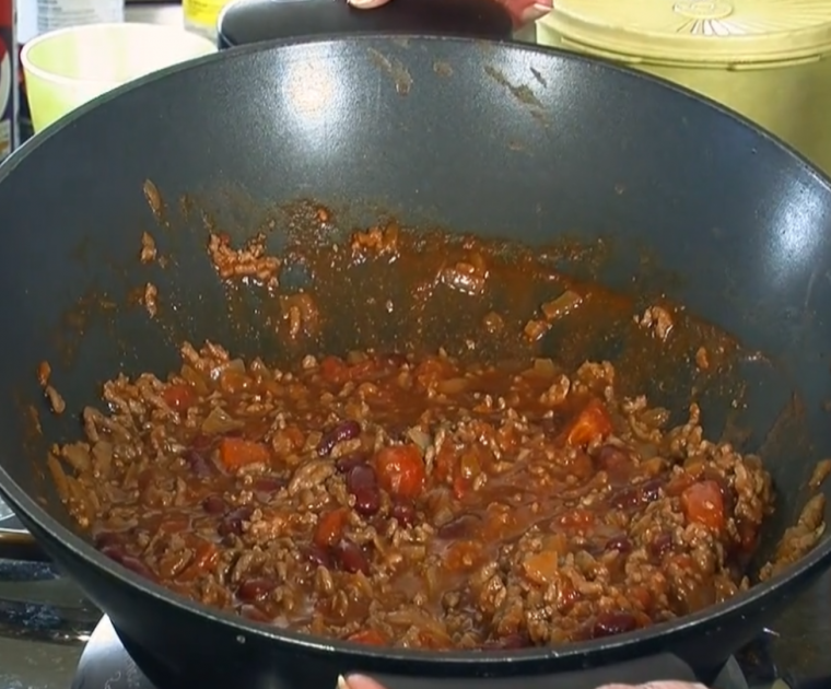 Close up of chilli con carne being cooked in a wok