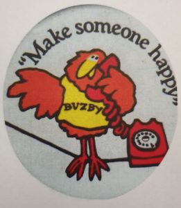 Phone a friend - a button badge from the mid '80s with the telephone company slogan "Make someone happy" on Buzby-bird's tshirt as he perches on a telephone wire to make a call.