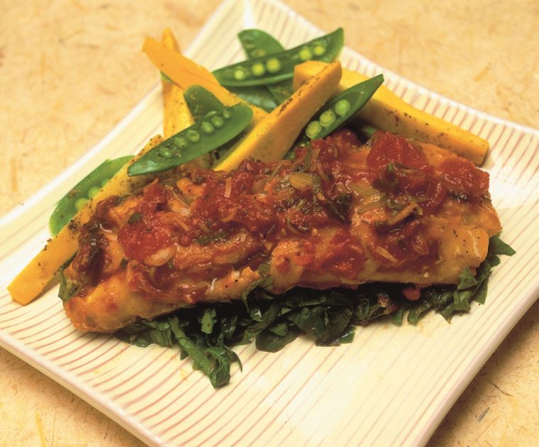 a square dish of Baked Smoked Haddock with assorted vegetables