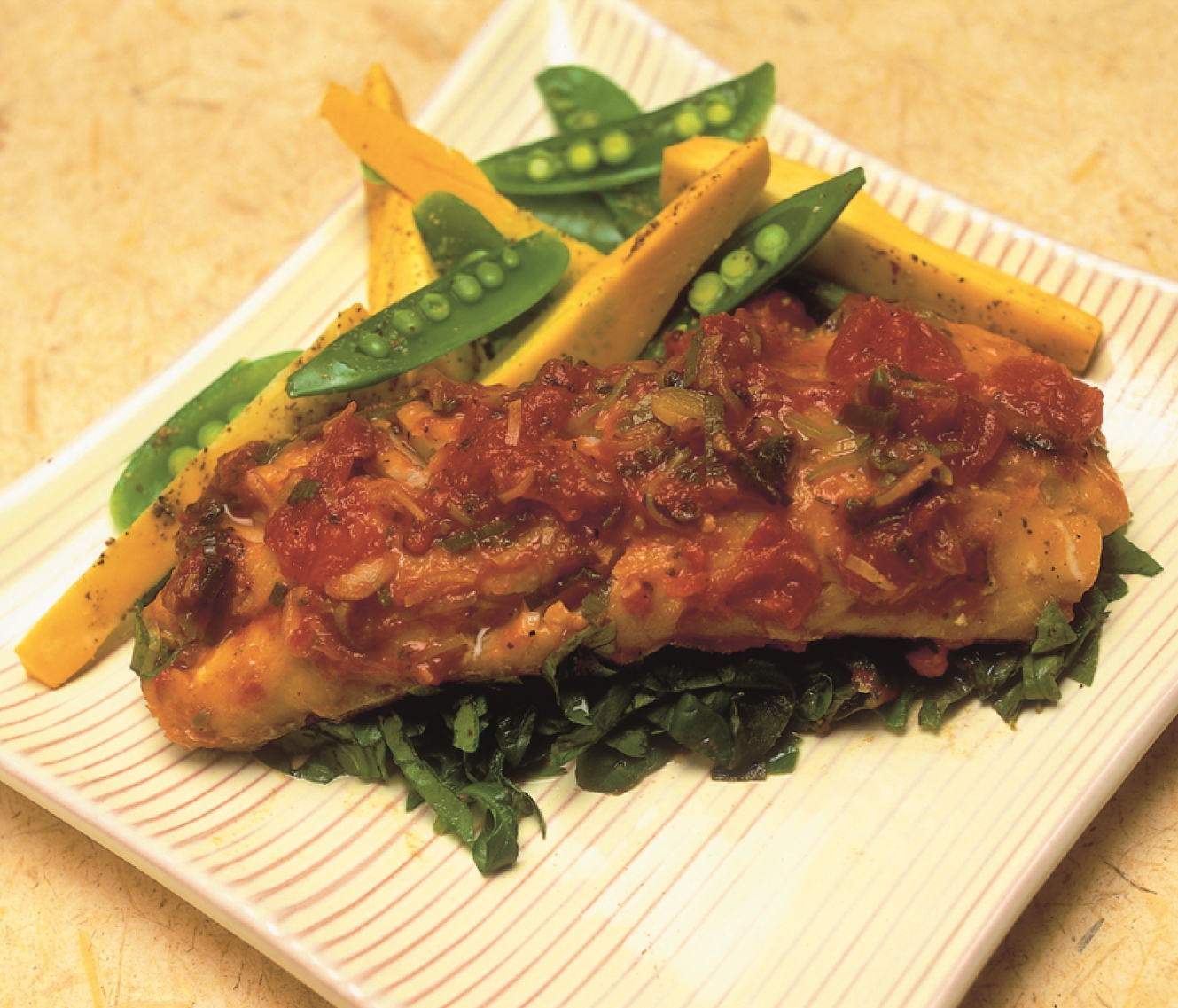 Baked Smoked Haddock Front Page a square dish of Baked Smoked Haddock with assorted vegetables