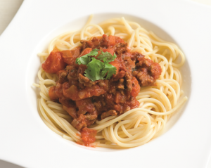 Spaghetti Bolognese piled on a white plate