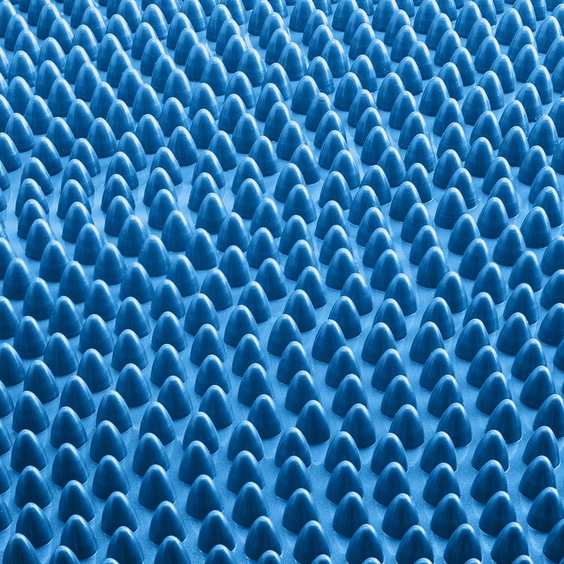 Close up of the lymph-stimulating bobbles on the rougher side of the Core Balance inflatable cushion