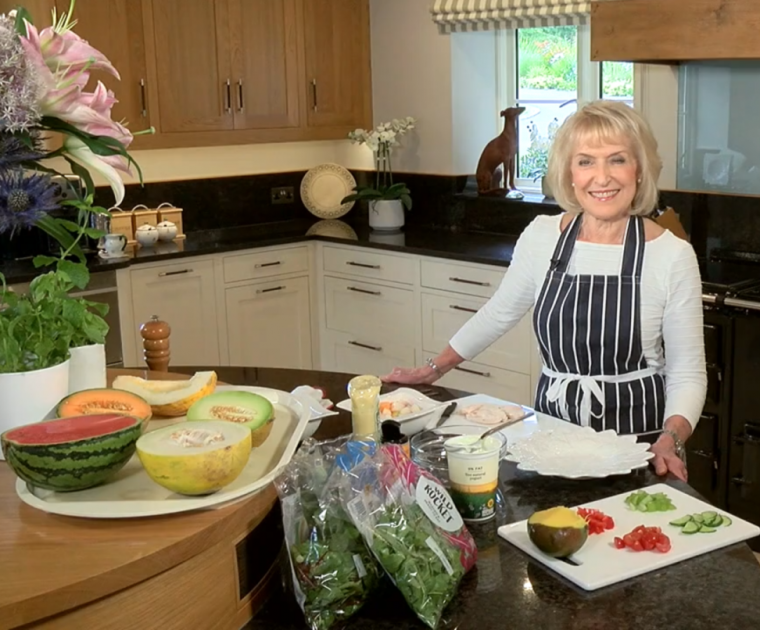Rosemary conley in her kitchen with an assortment of melons