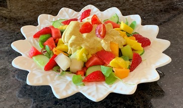 a star shaped dish of coronation chicken salad