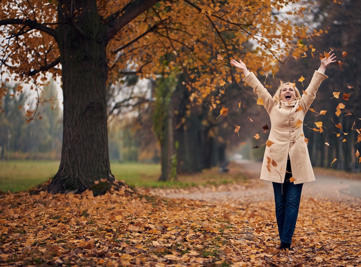 Senior woman in park in autumn