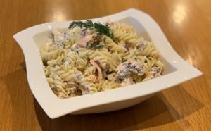 Fresh Salmon Pasta Salad in a square white bowl garnished with dill300