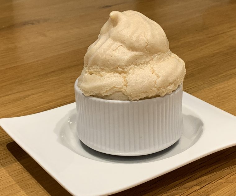 Queen of Puddings - A meringue topped dessert in an individual ramekin dish.