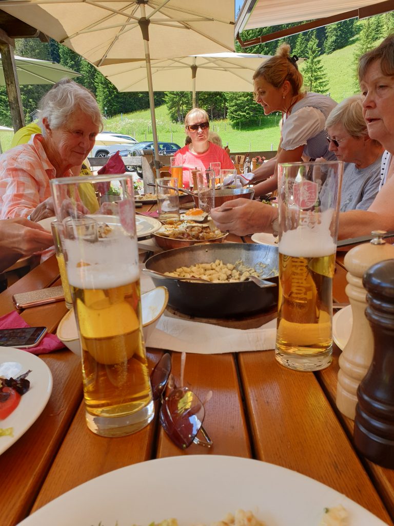Austrian Activity Holiday group having lunch in the sun at a local restaurant