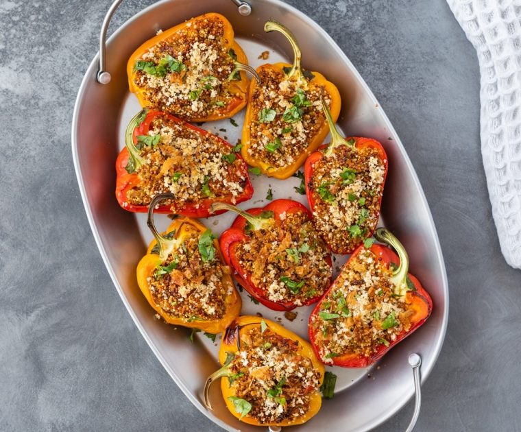 Sardine Baked Peppers made with halved bell peppers stuffed with tomatoes, garlic and sardines, baked in a white oven-proof dish