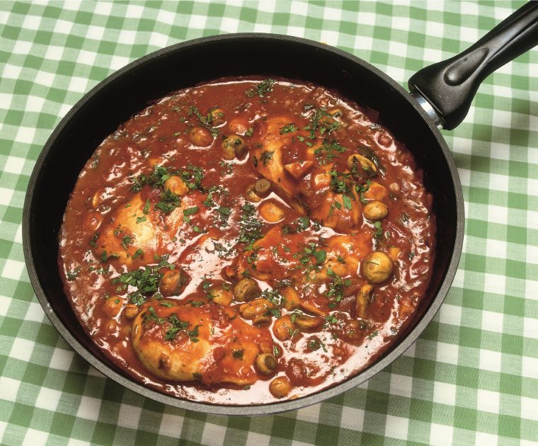 Chicken Winter Casserole, Chicken in a tomato, red wine and herb sauce in a frying pan