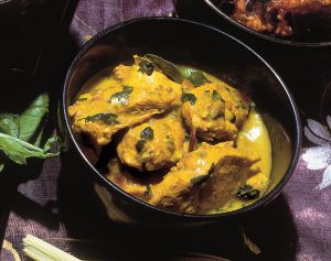 Thai Green Curry in a round black cooking pot