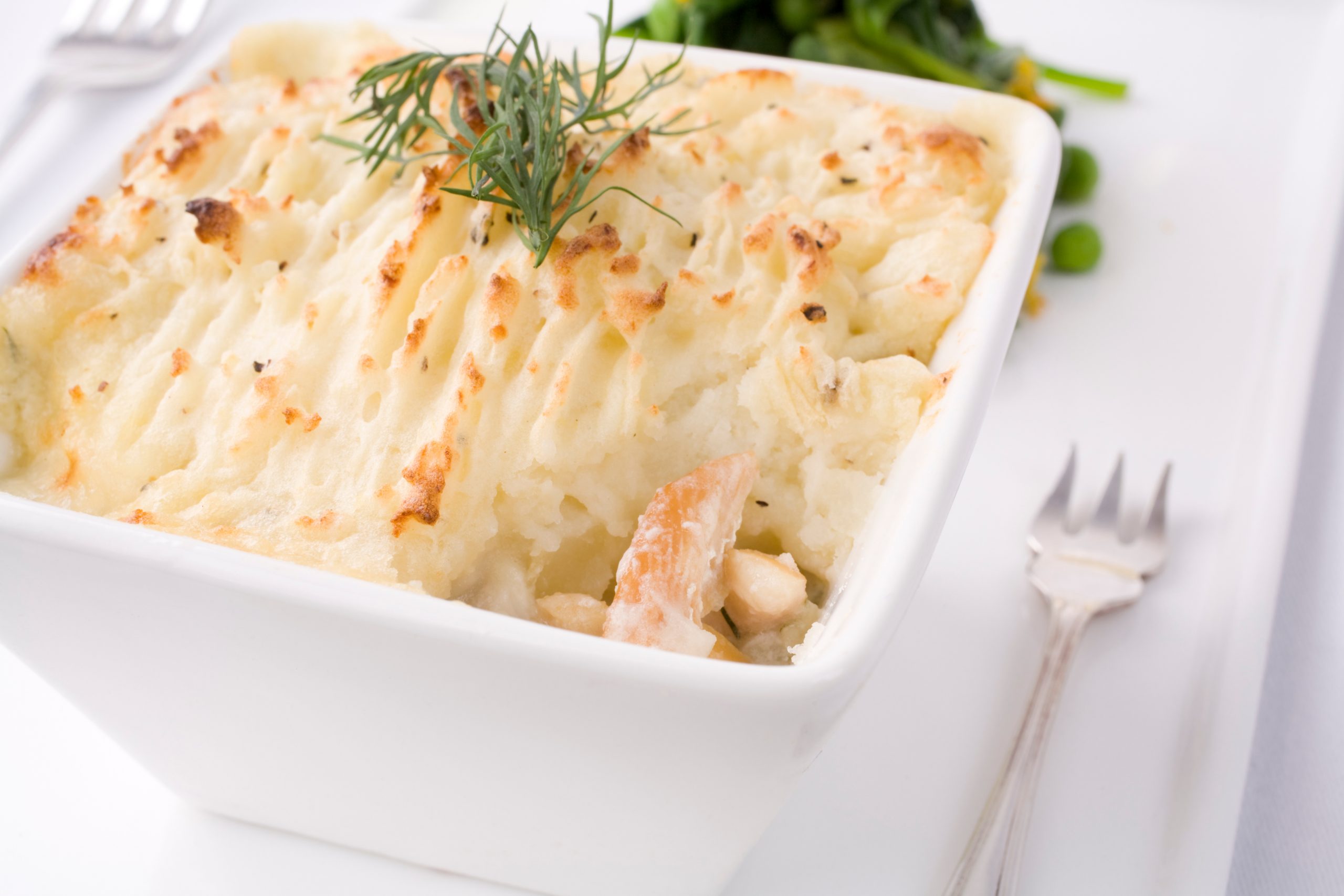 Smoked haddock and potato pie topped with mashed potato and garnished with dill