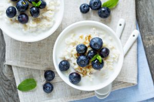 Bowls of rice pudding topped with blueberries